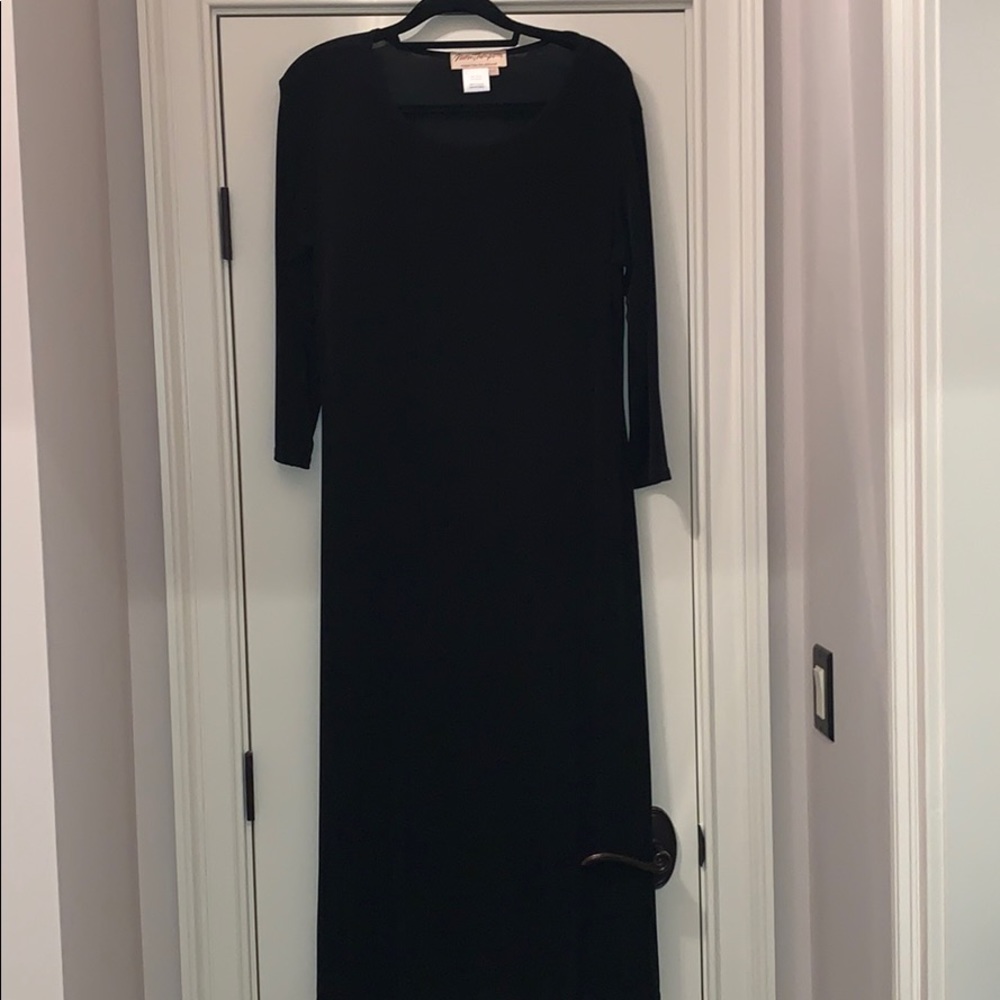 Classic black dress with 3/4 length sleeve.